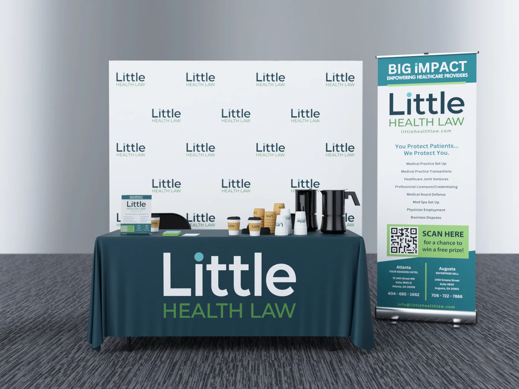 Little Health Law 10x10 exhibit with a repeating logo wall and branded table