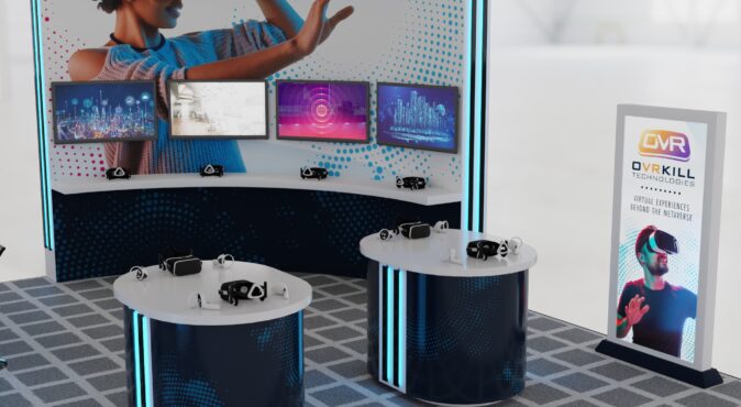 VR booth with multiple screens, virtual reality headsets, and a branded display for a technology exhibit, showcasing immersive experiences and innovative metaverse solutions.